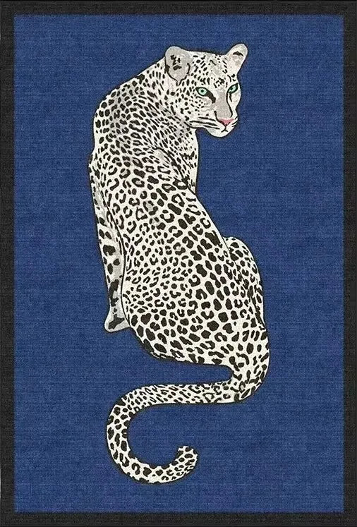 A stylized illustration rug of a spotted big cat, likely a leopard or jaguar, seated against a textured blue background with a dark border.