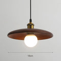 Wooden pendant light with a bulb on a gray background