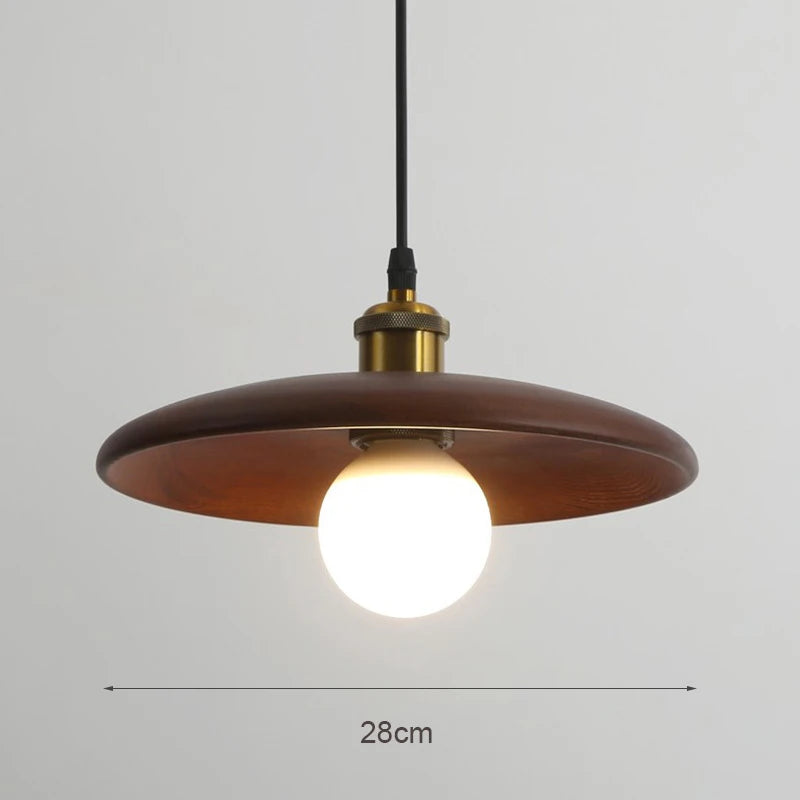 Wooden pendant light with a bulb on a gray background