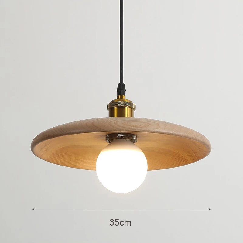 Wooden pendant light with a bulb on a gray background